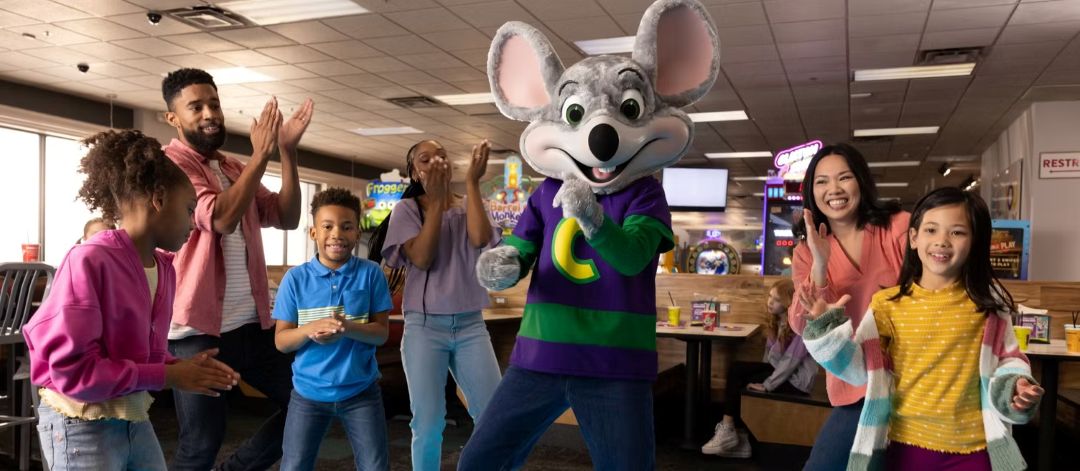 Children participating in the Mini Chef Experience and playing games during Family Brunch at Chuck E. Cheese Qatar